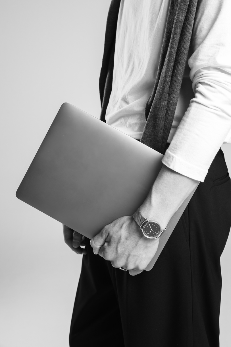 Man Holding a Laptop